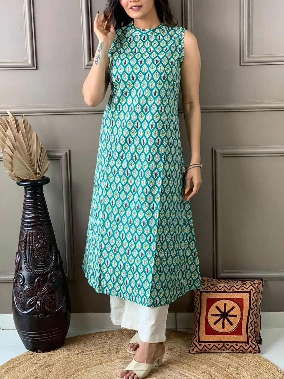 Check out the elegant Turquoise Cotton Embroidered Casual Kurti -